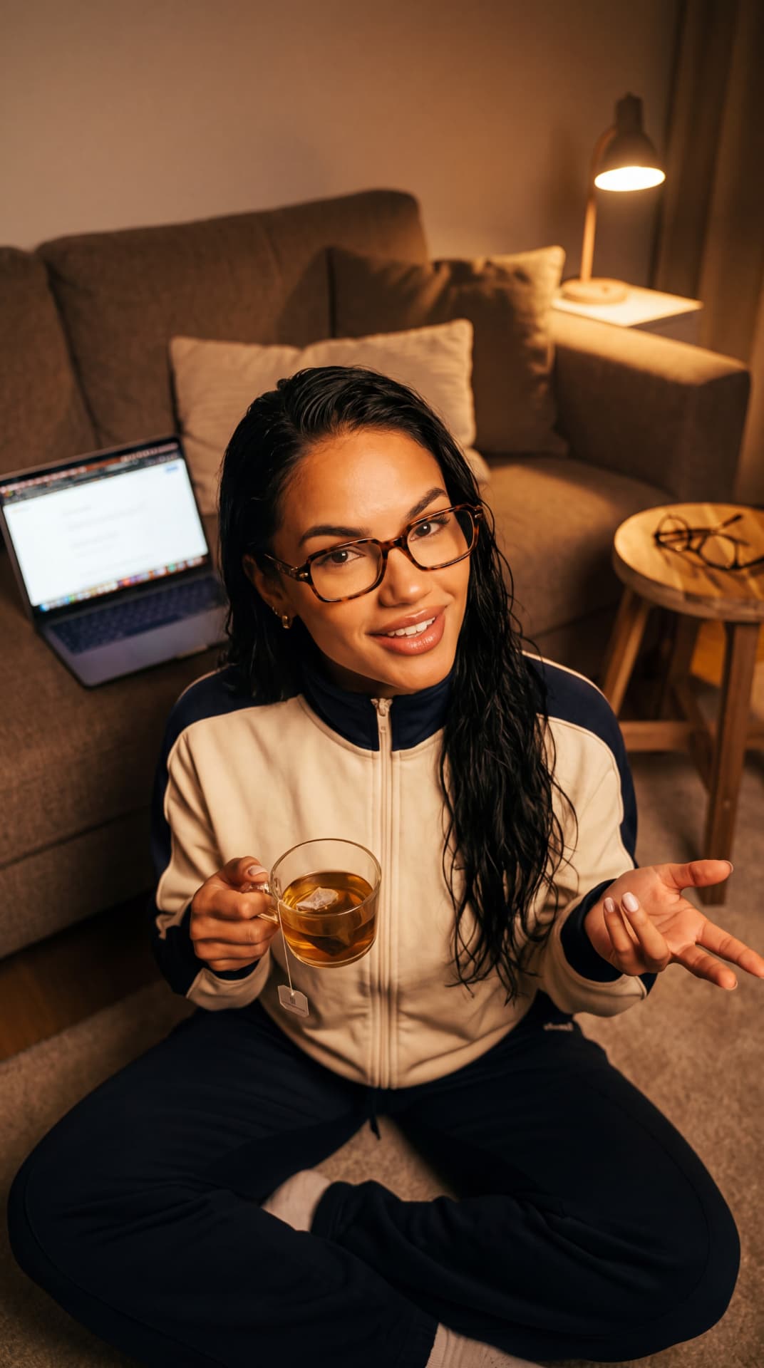 Creator relaxing at home with tea and a laptop